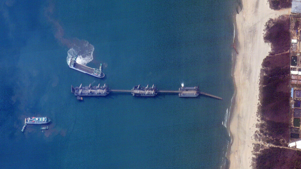 Vast Chinese barges spotted off the country's south coast could be used to land heavy equipment and thousands of personnel in a possible invasion of Taiwan, experts say