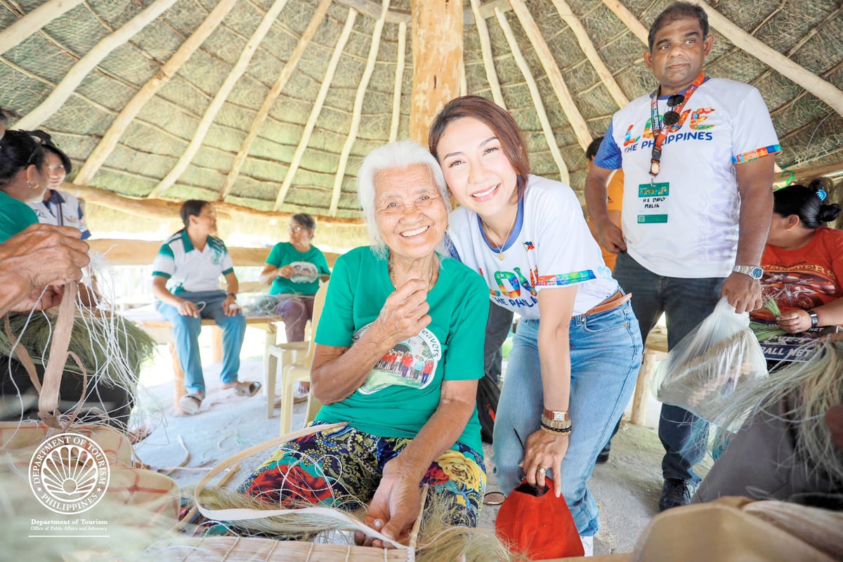 Secretary Frasco takes a selfie with ‘vakul’ weaver in Sabtang.