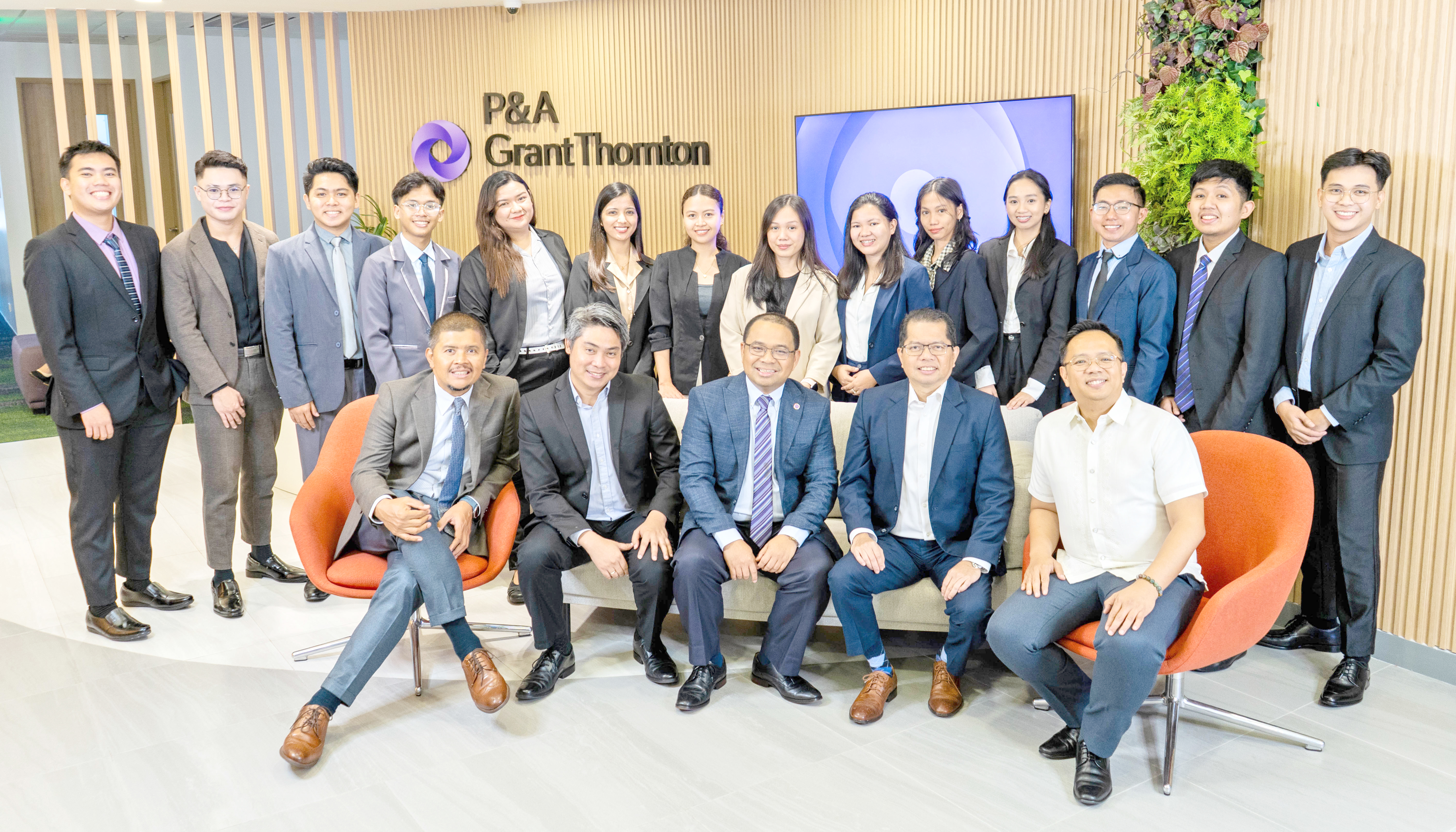 Posing with fresh graduates are P&A Grant Thornton leaders (from left) Elie Marcelo, business process solutions practice leader; Atty. Olivier D. Aznar, vice chairman and managing partner, and people and culture group leader; Romualdo V. Murcia III, chairman and managing partner; Ramil Nanola, audit and assurance practice leader; and Mhycke C. Gallego, advisory practice leader and knowledge management group leader.