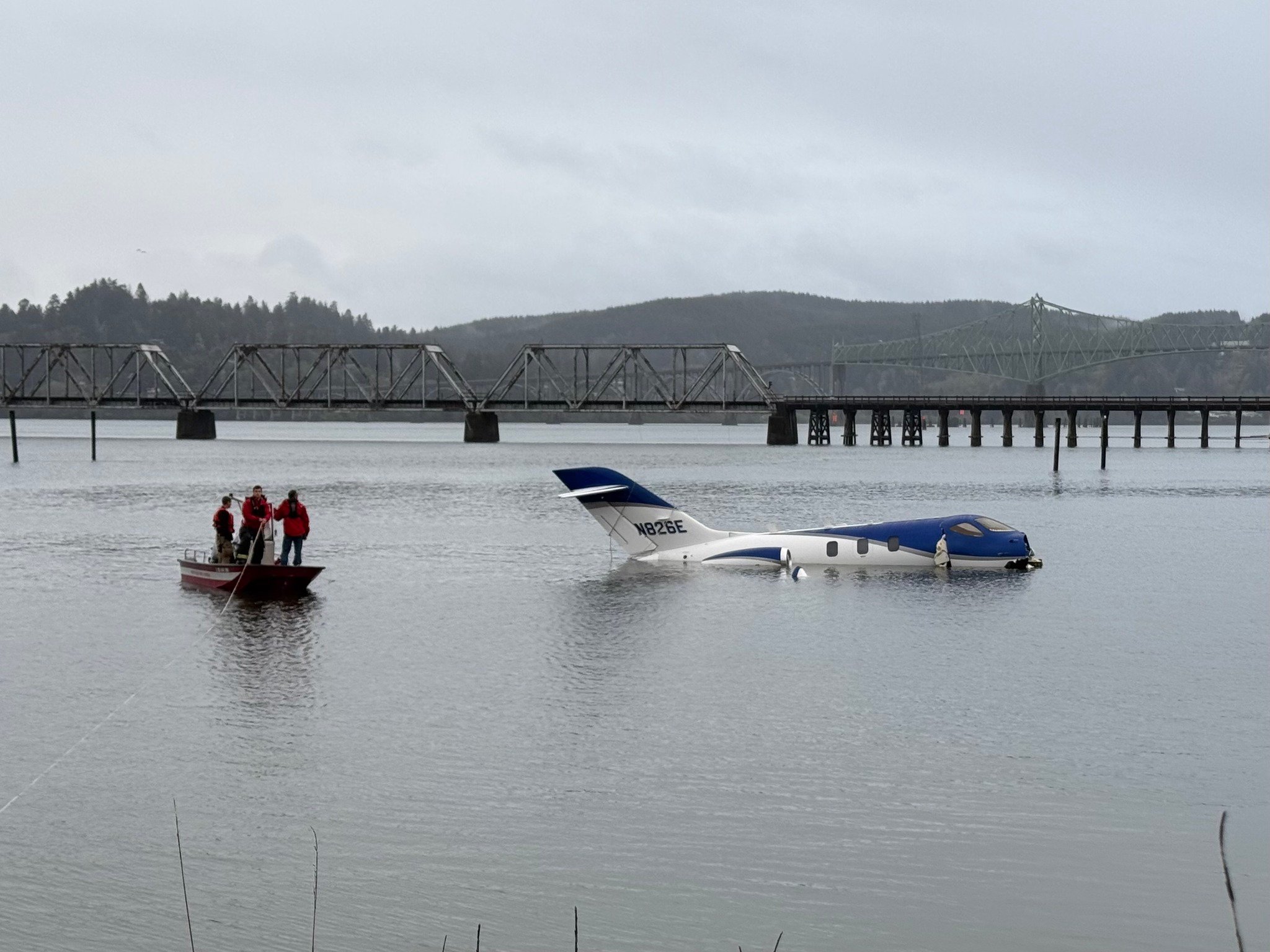 Five rescued after small jet plunges into bay at Oregon airport