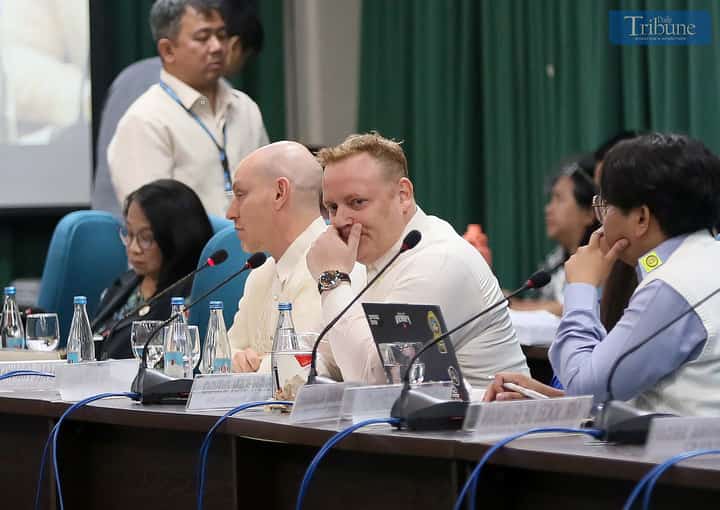 Director of Public Policy for Southeast and South Asia at Meta, Dr. Rafael Frankel, and Meta’s Rob Abrams speak during the joint committee hearing of Public Order and Safety, DICT, and Public Information at the House of Representatives in Quezon City. Outside the venue, protesters tied white ribbons to condemn fake news, red-tagging, and stand in solidarity with EJK victims and others facing political persecution.