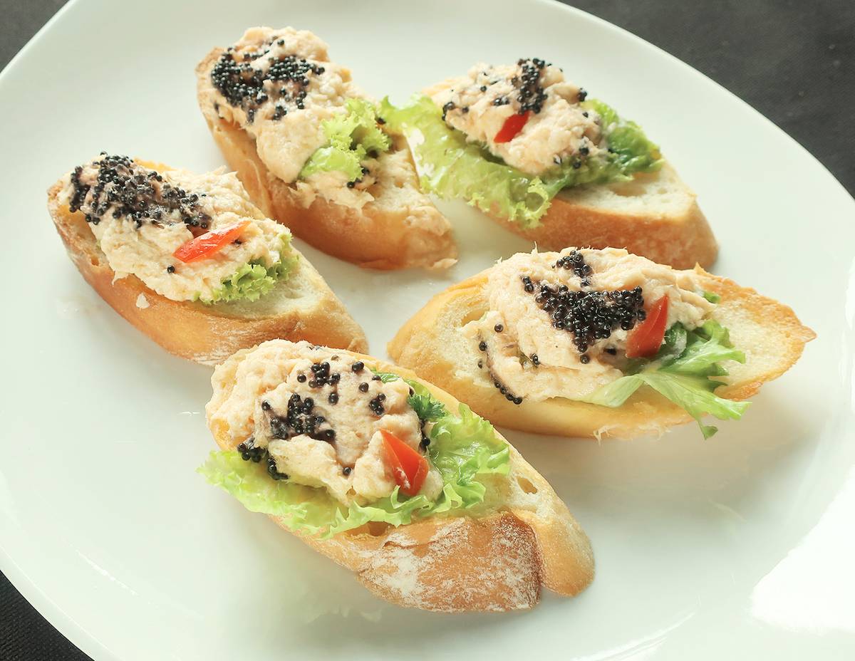 Salmon Mousse on Melba Toasts.