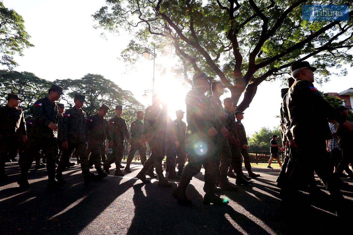 In celebration of Araw ng Kagitingan on Wednesday, 9 April 2025, members of the Philippine Army and ROTC contingents from various schools participate in the Freedom March around the academic oval of the University of the Philippines in Diliman, Quezon City.