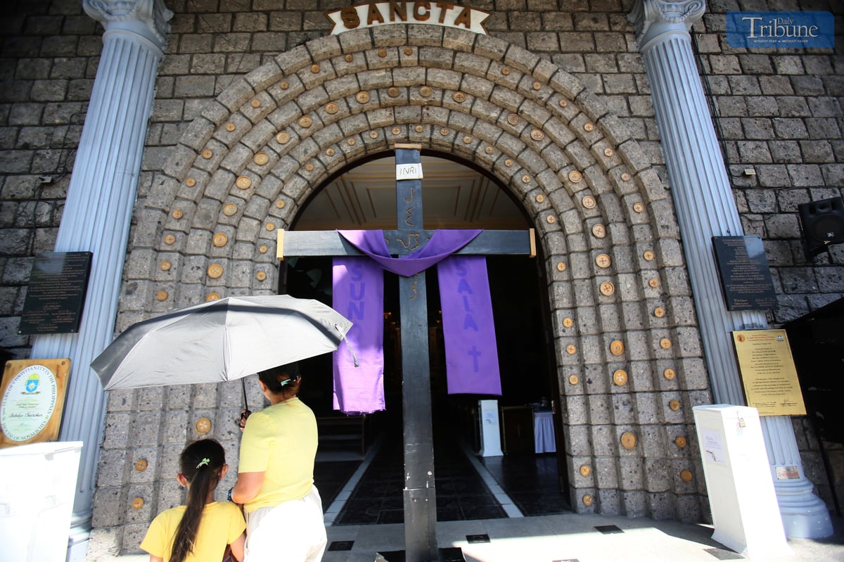 A giant cross is displayed at the entrance of St. Peter Parish Shrine of Leaders as part of a Lenten devotion commemorating Christ’s carrying of the cross and crucifixion during the fifth week of Lent.