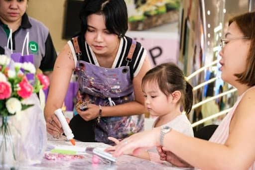 Participants enjoy a relaxing afternoon of rhinestone painting at Book Nook SM Podium, transforming simple canvases into sparkling works of art.