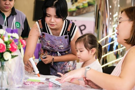 Participants enjoy a relaxing afternoon of rhinestone painting at Book Nook SM Podium, transforming simple canvases into sparkling works of art.