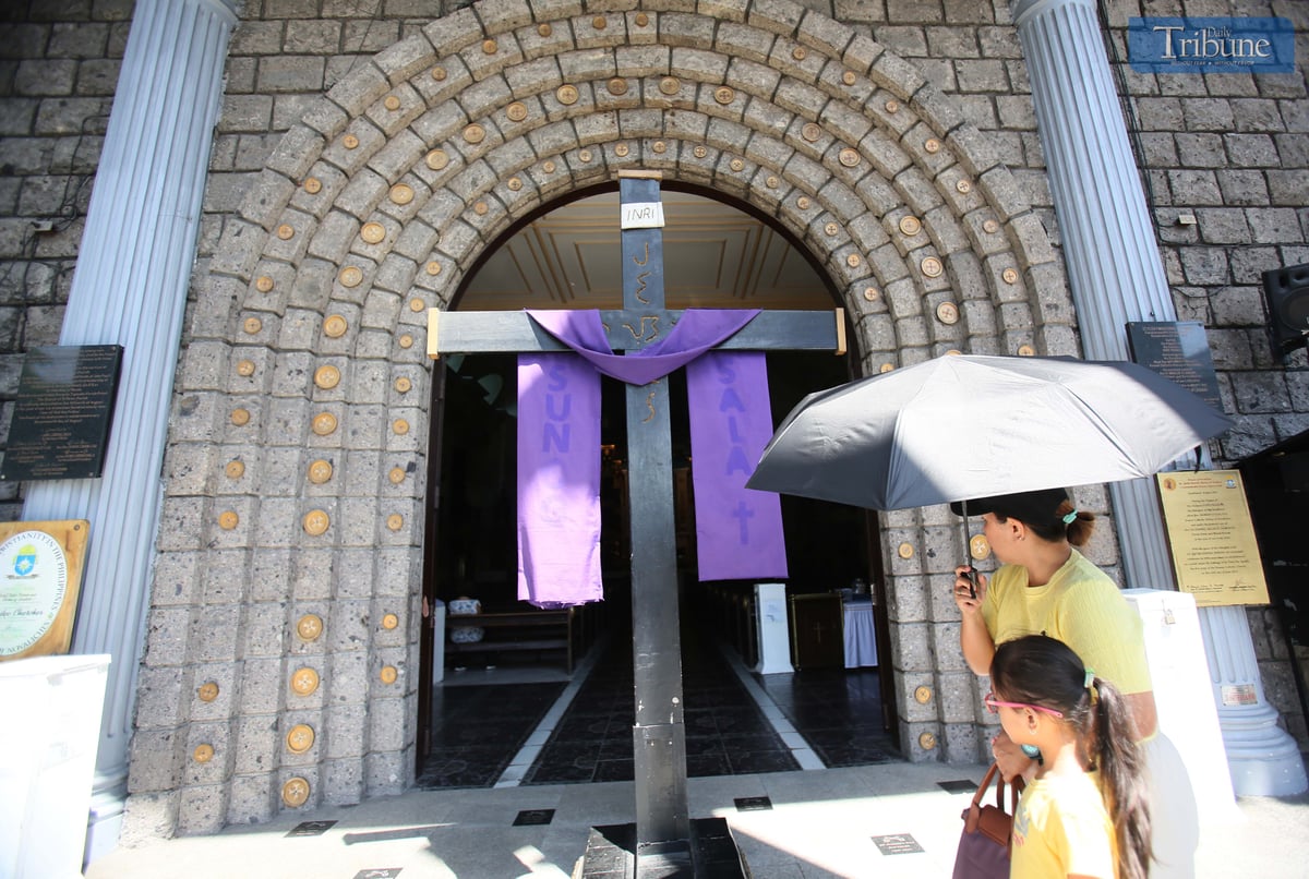 A giant cross is displayed at the entrance of St. Peter Parish Shrine of Leaders as part of a Lenten devotion commemorating Christ’s carrying of the cross and crucifixion during the fifth week of Lent.