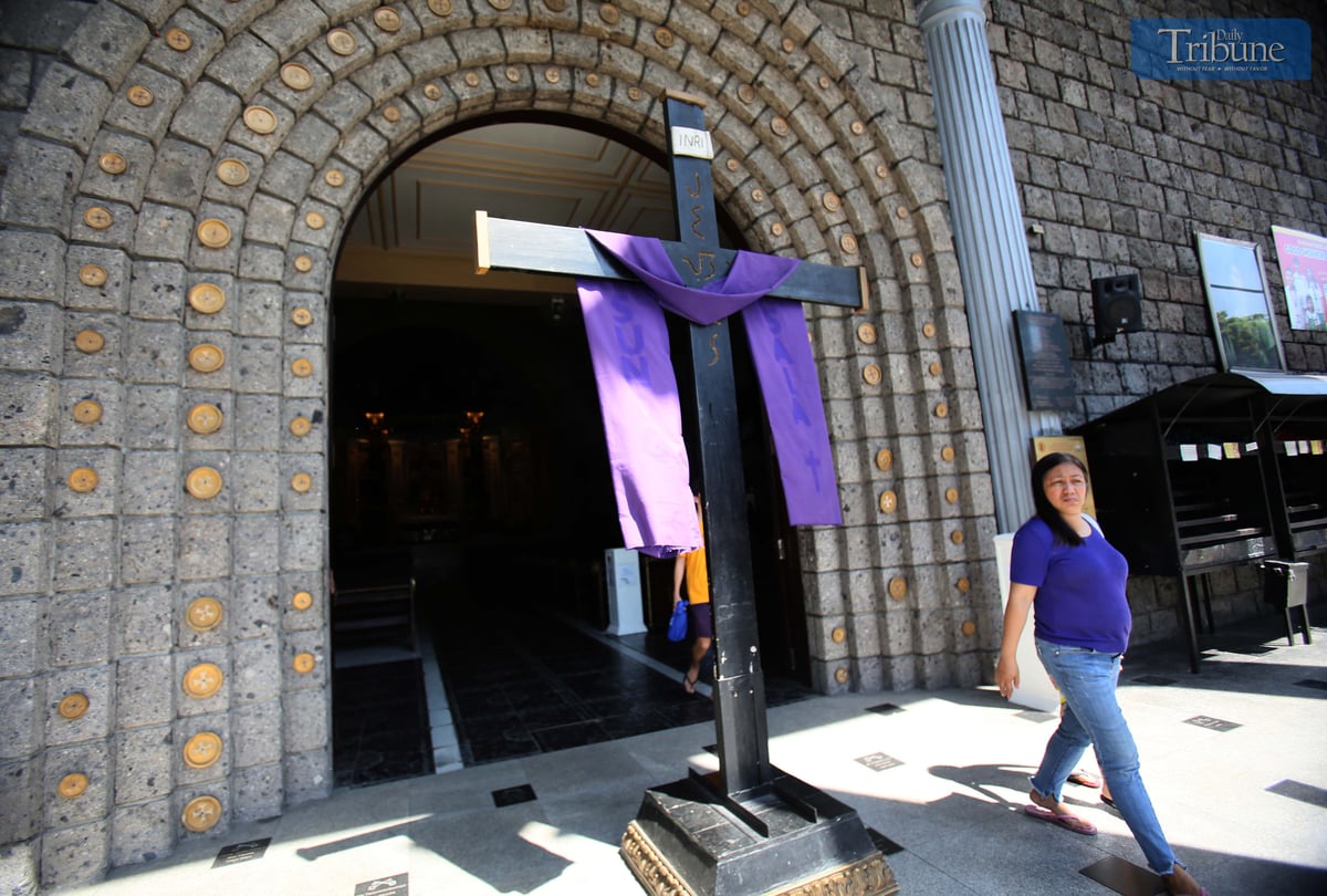 A giant cross is displayed at the entrance of St. Peter Parish Shrine of Leaders as part of a Lenten devotion commemorating Christ’s carrying of the cross and crucifixion during the fifth week of Lent.