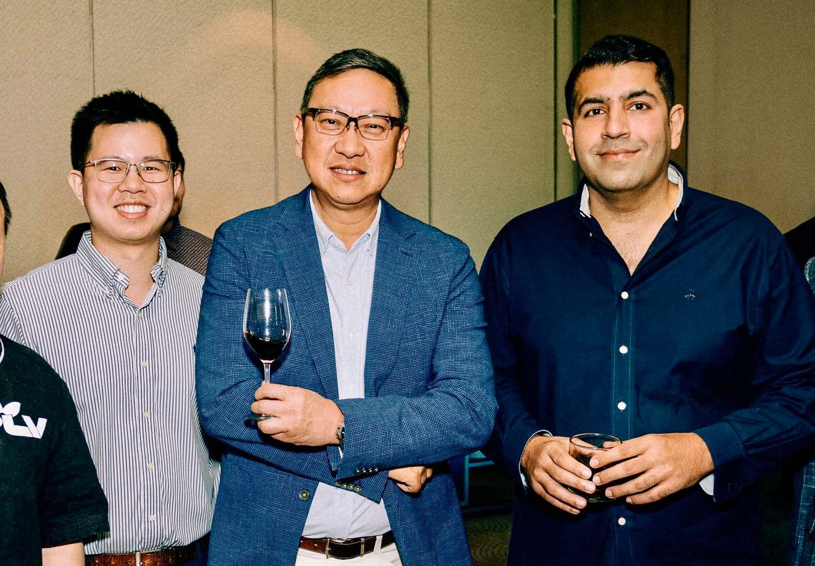 Mark and Emerson Yao with Rajiv Dargani.