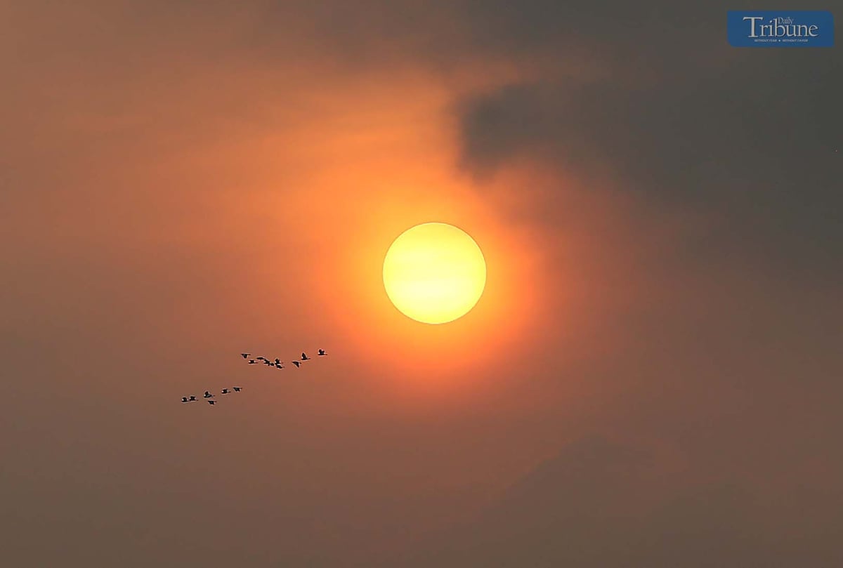 A hazy sunrise paints the sky at 6 AM in Caloocan City, Friday,  11 April 2025.
