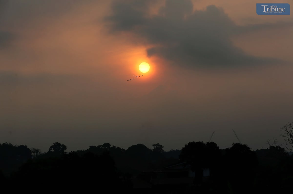 A hazy sunrise paints the sky at 6 AM in Caloocan City, Friday,  11 April 2025.