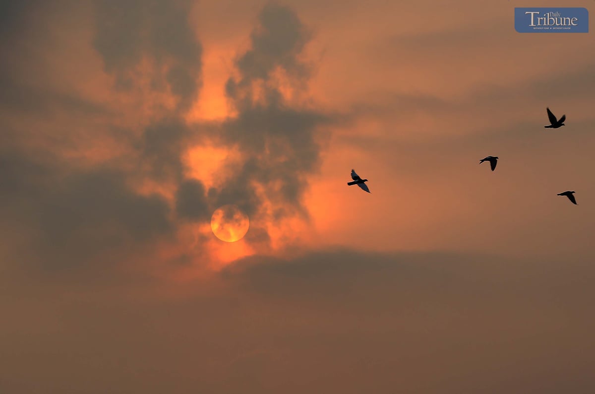 A hazy sunrise paints the sky at 6 AM in Caloocan City, Friday,  11 April 2025.