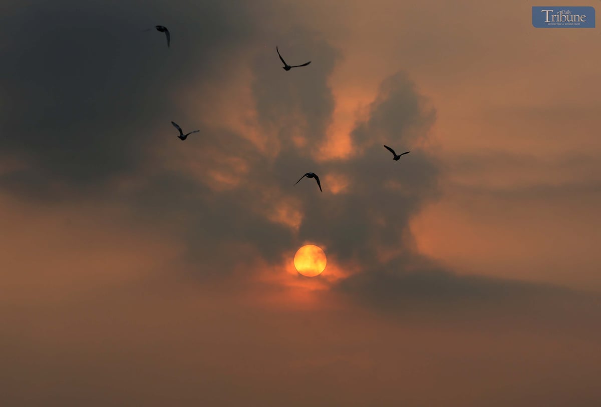 A hazy sunrise paints the sky at 6 AM in Caloocan City, Friday,  11 April 2025.