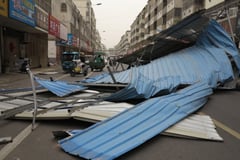 Strong winds cancel flights in China, India storms kill 69