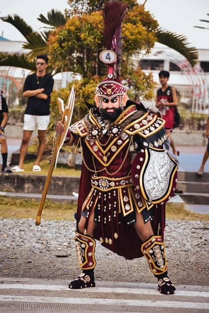 DRAPED in vibrant Roman-inspired armor and colorful tunics, the traditional Morion costume of Marinduque transforms devotees into fierce centurions.