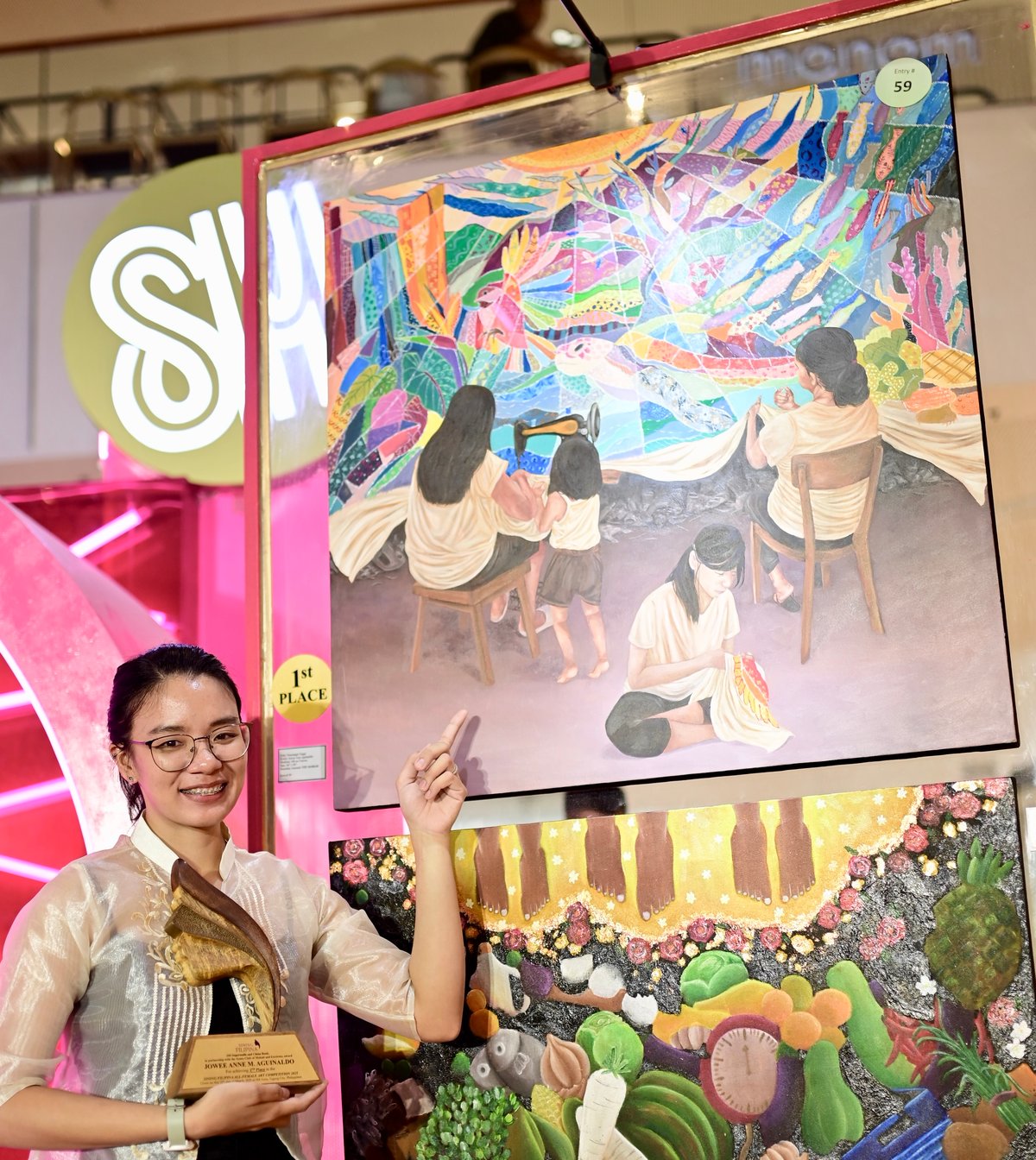 Jowee Anne Aguinaldo’s painting titled Pinagtapi-tapi won first place.