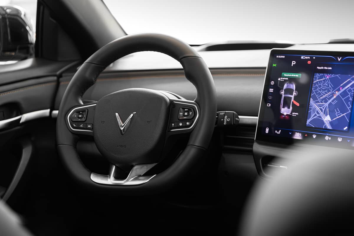 The VF 6 interior features a modern layout with a large touchscreen and intuitive controls.