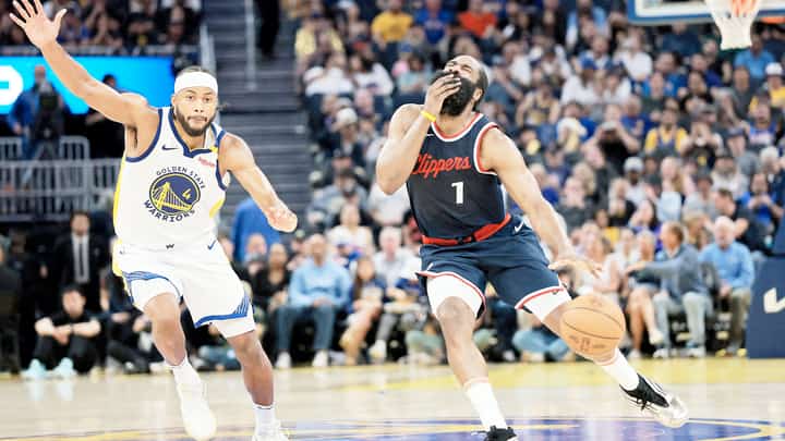 James Harden lights up the Los Angeles Clippers’ scoreboard with 39 points en route to a 124-119 overtime win over Golden State that sent them into the NBA playoffs.