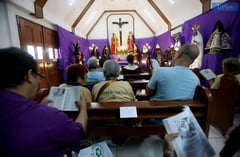 Devotees chant the Pasyon on Holy Tuesday in Quezon City