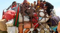 Afghan refugee children board a truck loaded with their belongings as they wait for their deportation to Afghanistan, at a holding centre near the Pakistan-Afghanistan border in Chaman on April 15, 2025