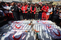 Israeli fire kills 22 near aid center, Gaza rescuers say