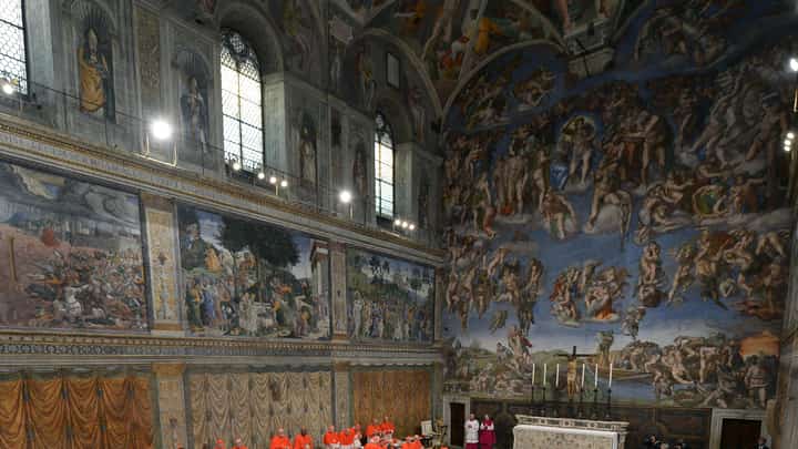 (FILES) This handout picture released by the Press office shows cardinals queuing in the Sistine Chapel to swear on the Bible to never reveal the secrets of their deliberations before the start of the conclave at the Vatican on 12 March 2013. Pope Francis died on 21 April 2025 aged 88, a day after making a much hoped-for appearance at Saint Peter's Square on Easter Sunday, the Vatican said in a statement.