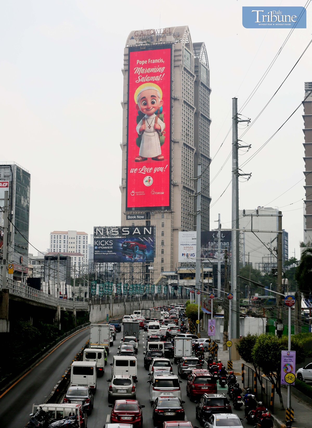 A cartoonized photo of Pope Francis is seen displayed on an electronic billboard along EDSA in Mandaluyong on Wednesday, 23 April 2025, two days after his passing at age 88. Remembered for his populist approach and efforts to reach people from all walks of life, Pope Francis leaves behind a legacy of compassion, humility, and dialogue.