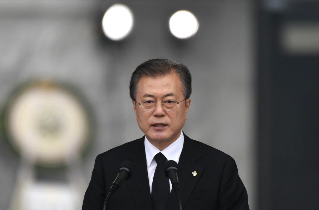 South Korean President Moon Jae-in delivers a speech during a Korean Memorial Day ceremony at the National Cemetery in Seoul on 6 June 2019, wearing a black suit and glasses.