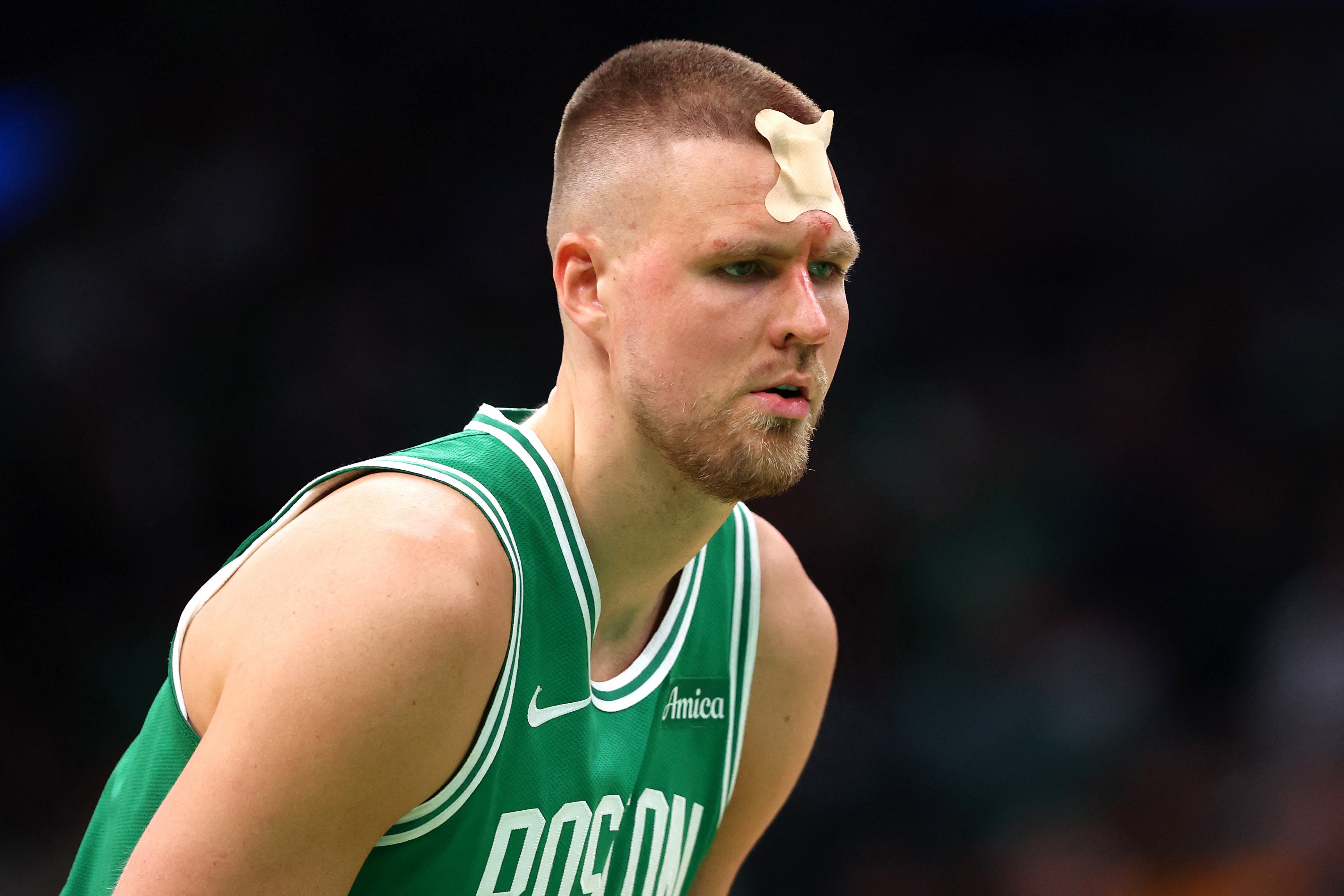 Tatum-less Celtics survive bloody battle
