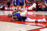 Jimmy Butler of the Golden State Warriors suffers a hard fall during Game 2 of their NBA Western Conference playoff series against the Houston Rockets.