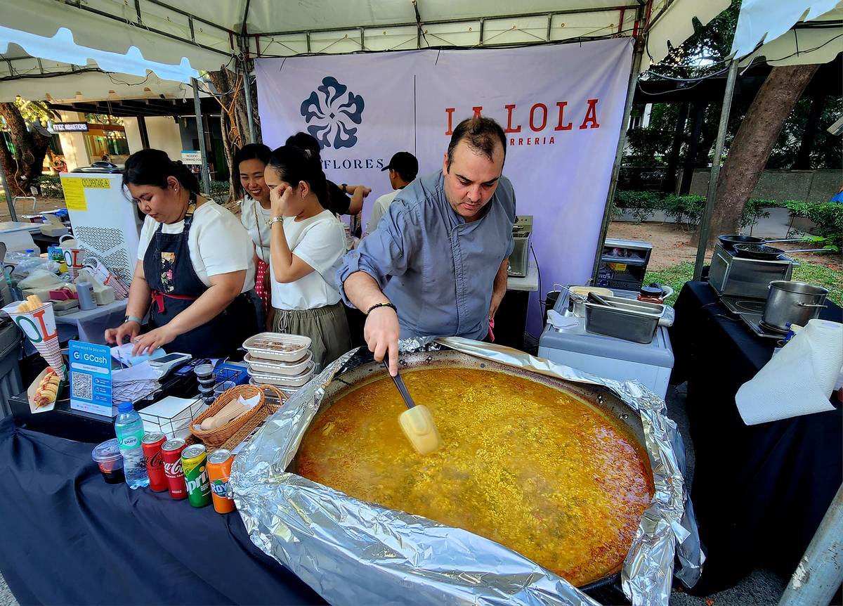A paella being cooked at the La Lola booth.
