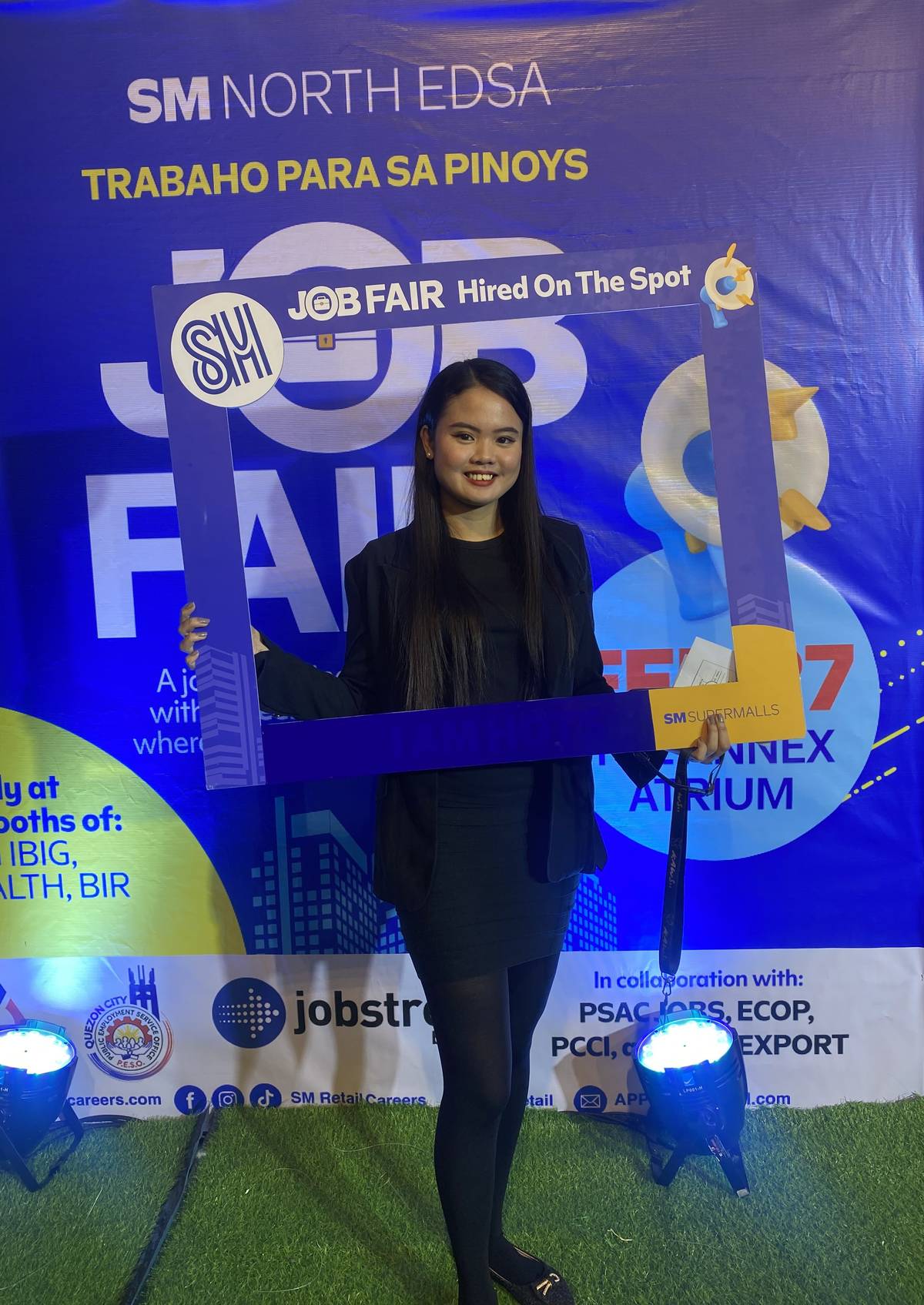 An applicant gets hired-on-the-spot during the SM Supermalls Job Fair.