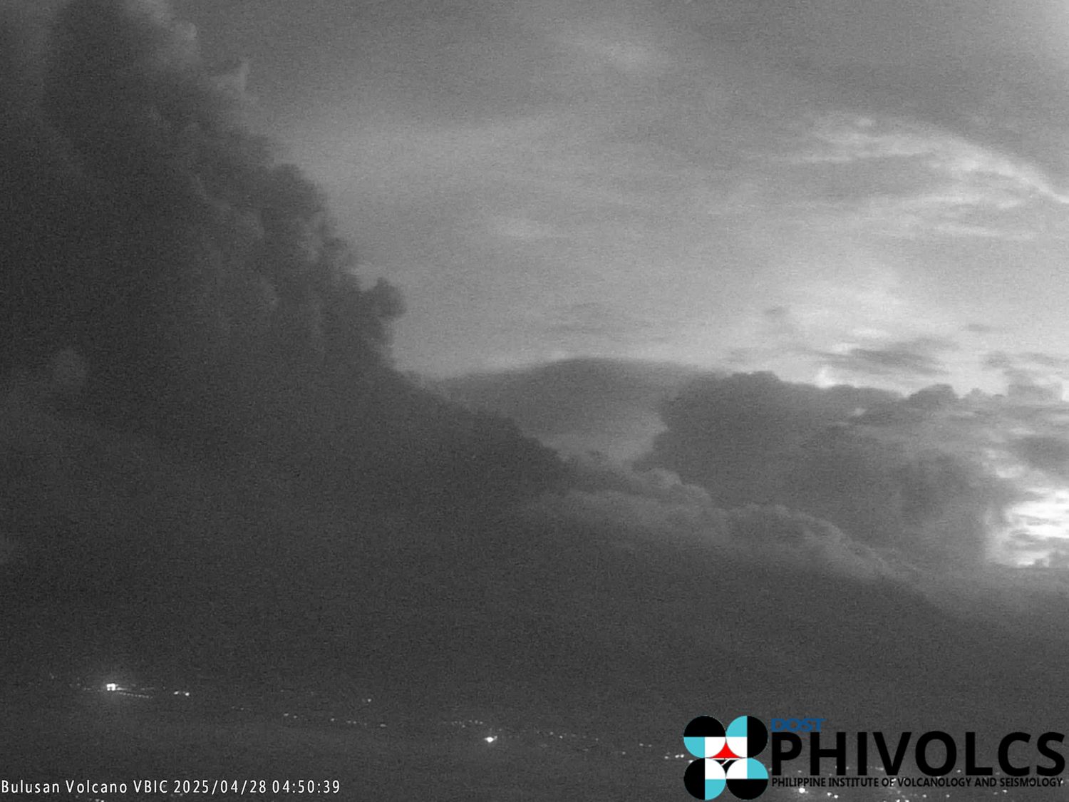 Ash plume rises over Mount Bulusan during a phreatic eruption captured by PHIVOLCS on 28 April 2025, with ash drifting across nearby towns in Sorsogon.