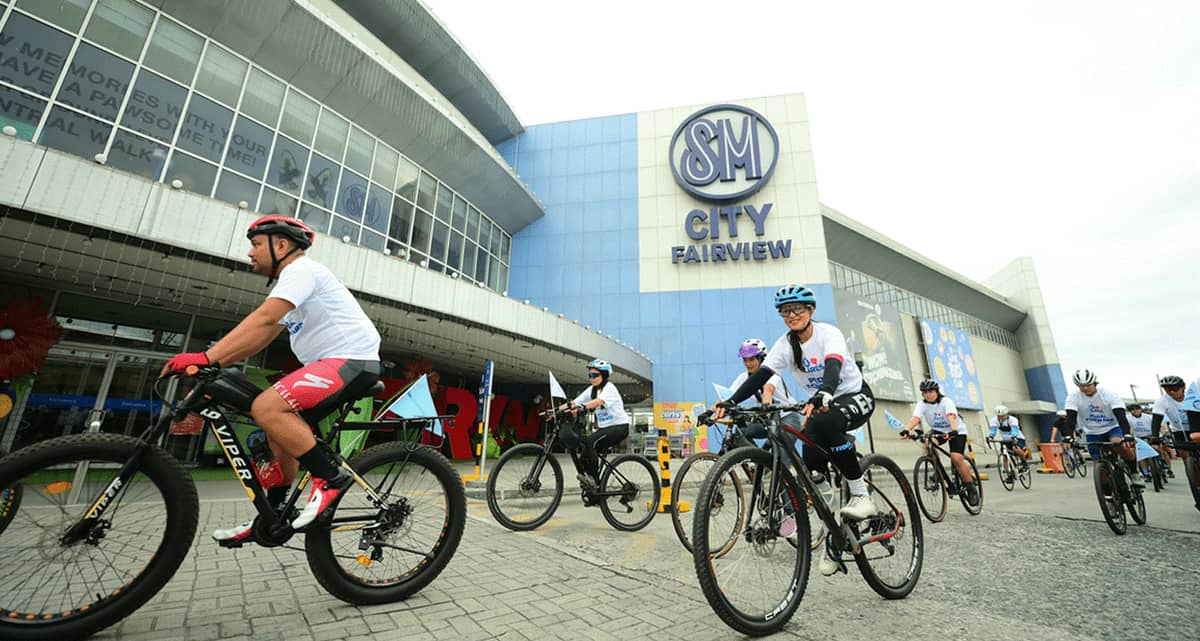 Cyclists kick off a summer fun ride in front of SM City Fairview, part of the mall’s fitness-focused community events.c