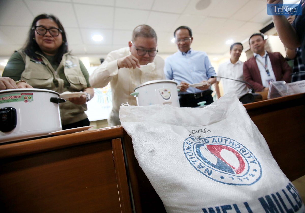 Department of Agriculture Secretary Francisco P. Tiu Laurel Jr., along with other officials, presents to the media a rice variety to be offered at P20 per kilo during a press conference at the DA head office in Quezon City on Tuesday, 29 April 2025. The demonstration aimed to highlight the rice’s quality and suitability for public consumption.