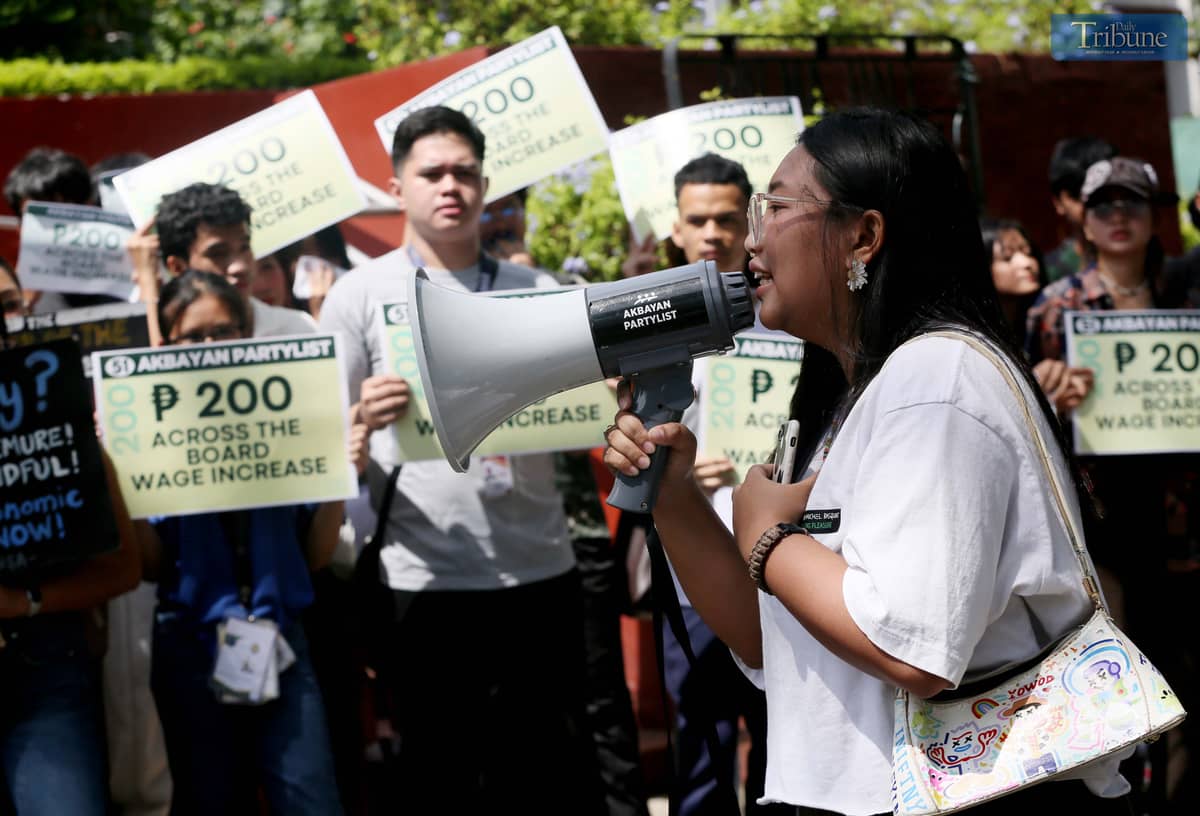 Hundreds of students join a solidarity walk organized by Akbayan Partylist for workers' rights at the University of the Philippines Diliman in Quezon City on Wednesday, 30 April 2025, vowing support for the passage of a P200 minimum wage hike, ahead of the Labor Day celebration.