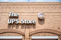 A UPS store exterior photographed in Austin, Texas, on 29 April 2025. The company is planning to cut 20,000 jobs and close 73 facilities worldwide following a significant drop in business with Amazon.