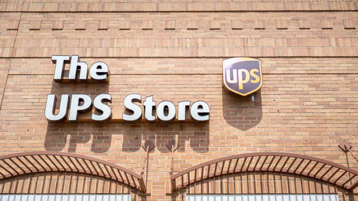 A UPS store exterior photographed in Austin, Texas, on 29 April 2025. The company is planning to cut 20,000 jobs and close 73 facilities worldwide following a significant drop in business with Amazon.
