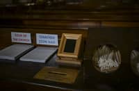 A Point of Sale (POS) device (C) is pictured at the Catholic Church of St Dionysius the Areopagite in Athens on May 4, 2025. Devout regulars attending Athens's main Roman Catholic church that honours a first-century saint have discovered a 21st-century update, with their donation box hooked up to a digital payments system.The addition of the Point of Sale (POS) device in the Cathedral Basilica of St Dionysius the Areopagite is the first in a Greek church, even though their use is common elsewhere, including in Africa.