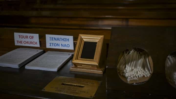 A Point of Sale (POS) device (C) is pictured at the Catholic Church of St Dionysius the Areopagite in Athens on May 4, 2025. Devout regulars attending Athens's main Roman Catholic church that honours a first-century saint have discovered a 21st-century update, with their donation box hooked up to a digital payments system.The addition of the Point of Sale (POS) device in the Cathedral Basilica of St Dionysius the Areopagite is the first in a Greek church, even though their use is common elsewhere, including in Africa.