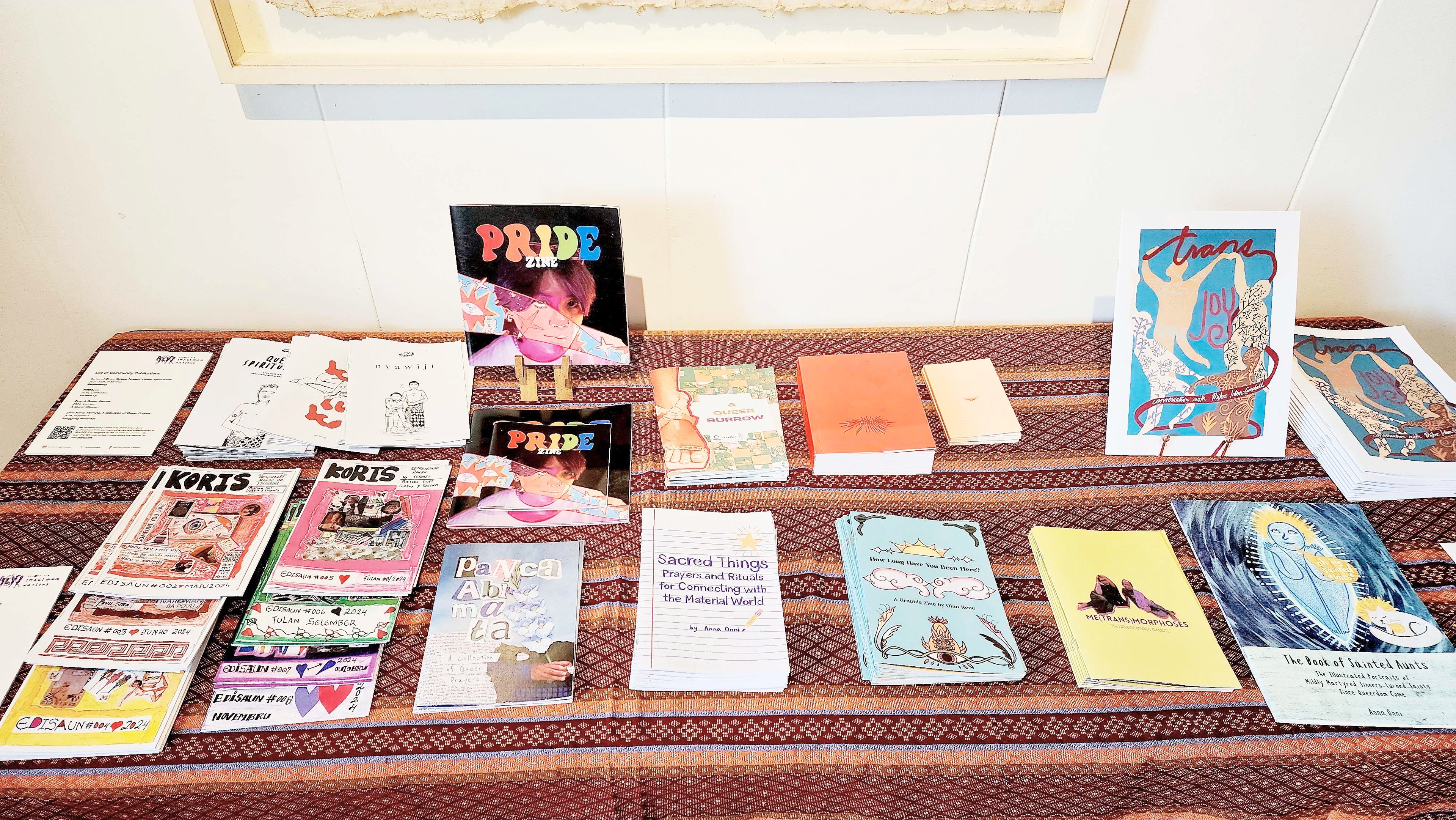 Queer books and zines on exhibit.