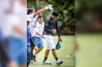 Ralph Batican gets a victory shower after ruling the 11-14 boys’ division of the ICTSI Mactan Island Junior PGT Championship on Tuesday.