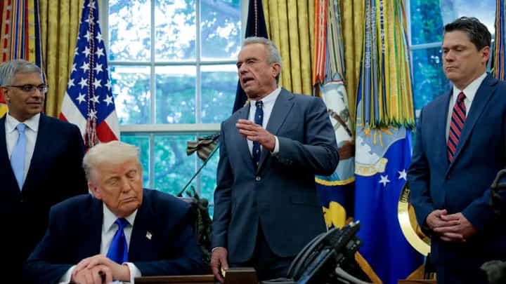 WASHINGTON, DC – U.S. Health and Human Services Secretary Robert F. Kennedy Jr. (C), accompanied by U.S. President Donald Trump (2nd-L) National Institutes of Health Director Jayanta Bhattacharya (L), and Domestic Policy Council Director Vince Haley (R), speaks in the Oval Office at the White House on May 05, 2025 in Washington, DC. Trump signed new proclamations and executive orders, including one that ends federal funding for so-called “gain-of-function” studies, which explores the use of microorganisms to alter biological functions in the aid of gene products.