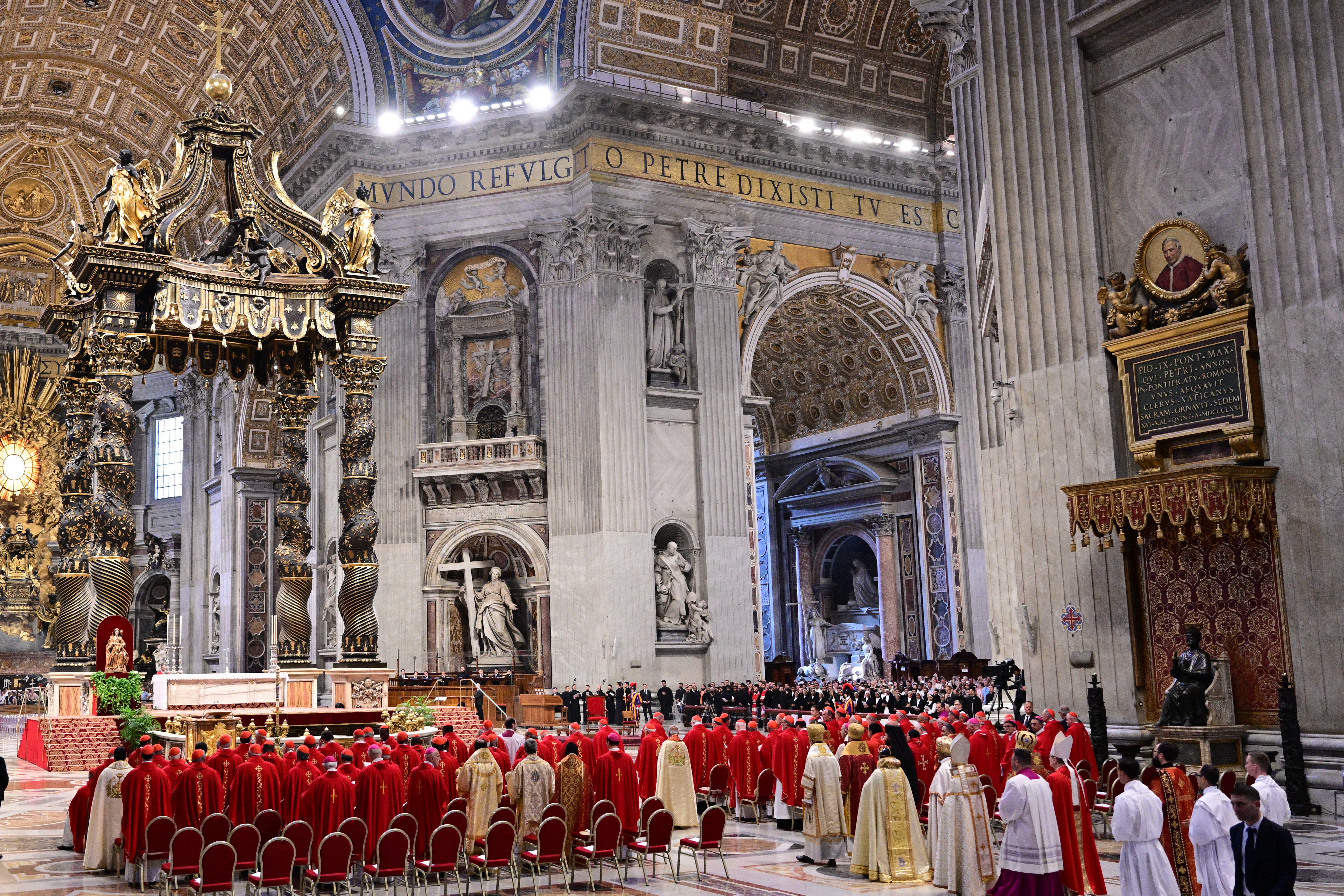 Cardinals in red vestments gather at St. Peter’s Basilica in the Vatican for the Seventh Novemdiale Mass on 2 May 2025, following the funeral of Pope Francis and ahead of the papal conclave.