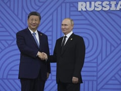 Xi meets Putin in Moscow as Ukraine reports truce violations