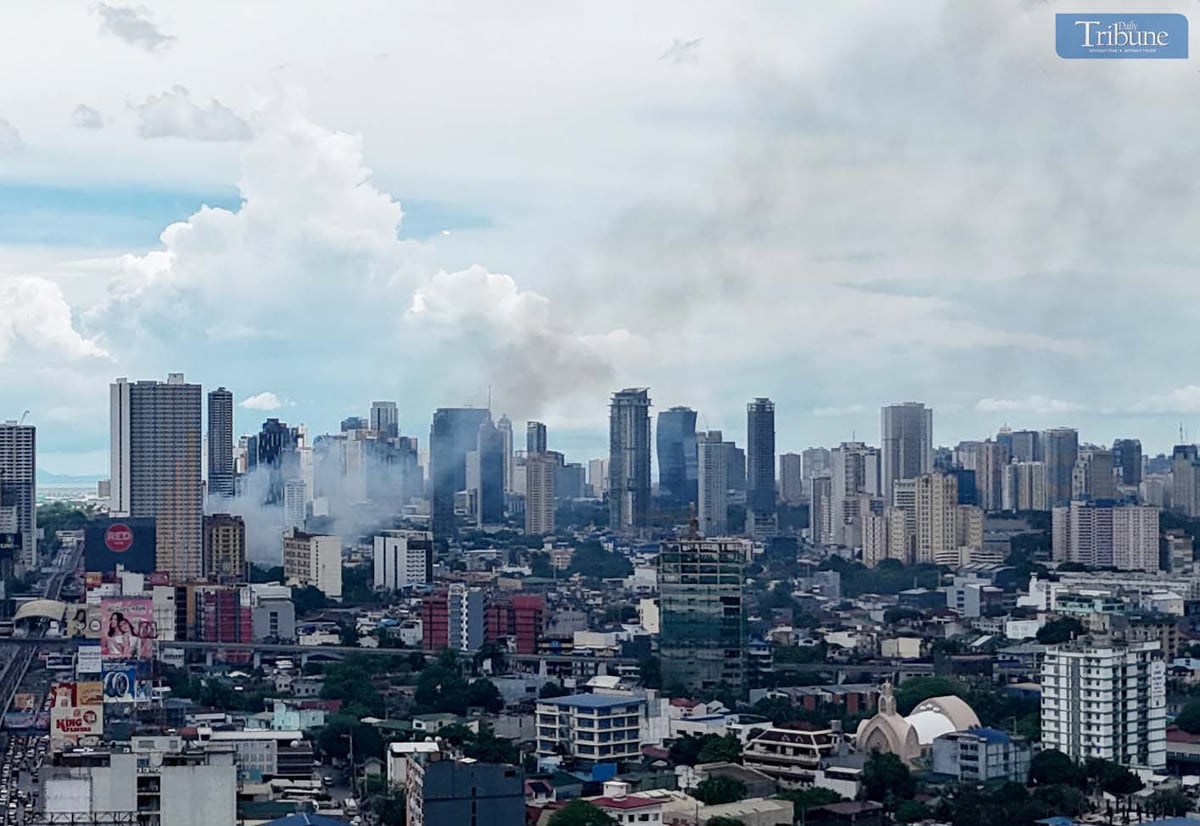 Smoke rises from a first alarm fire that broke out on 4th Avenue in Barangay Lipunan, Quezon City, on Thursday, 8 May 2025.
