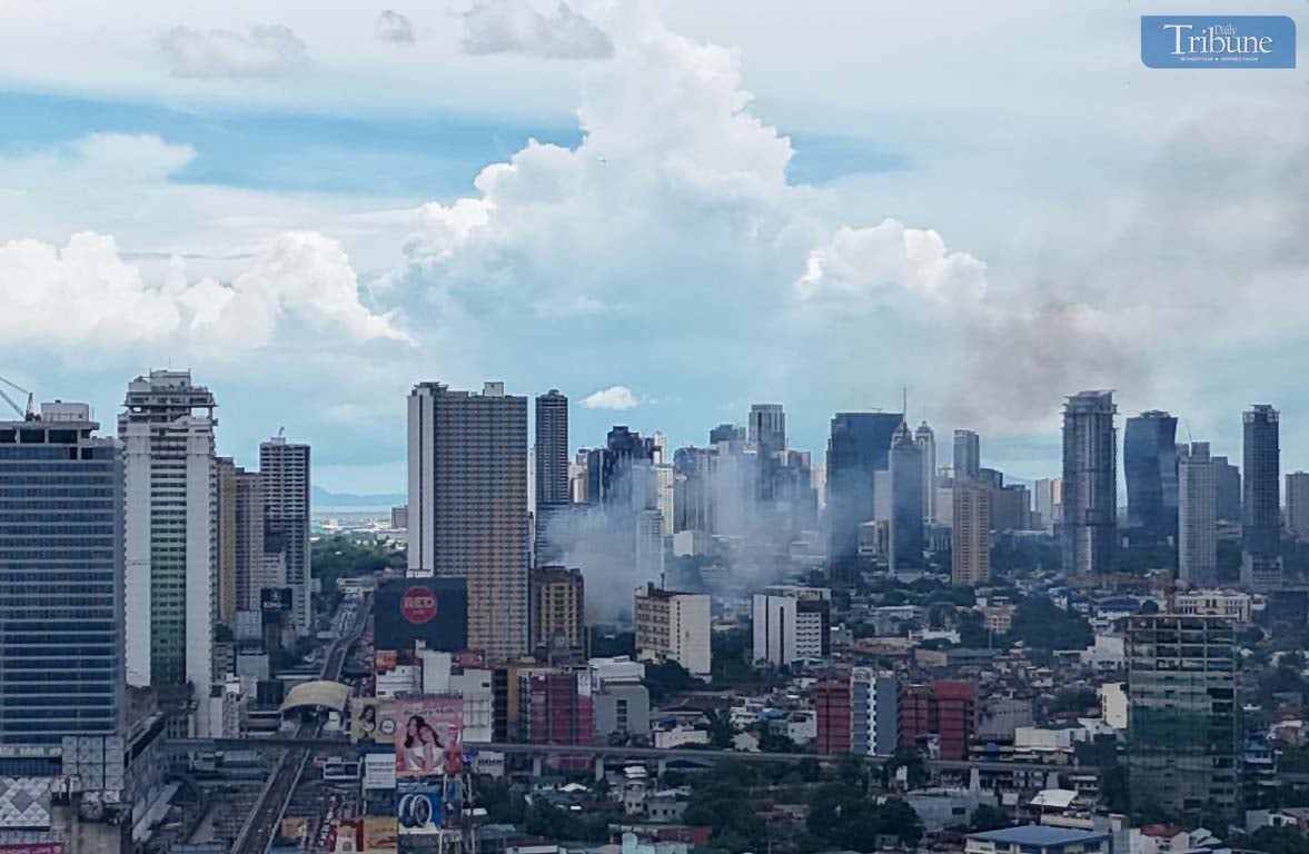 Smoke rises from a first alarm fire that broke out on 4th Avenue in Barangay Lipunan, Quezon City, on Thursday, 8 May 2025.