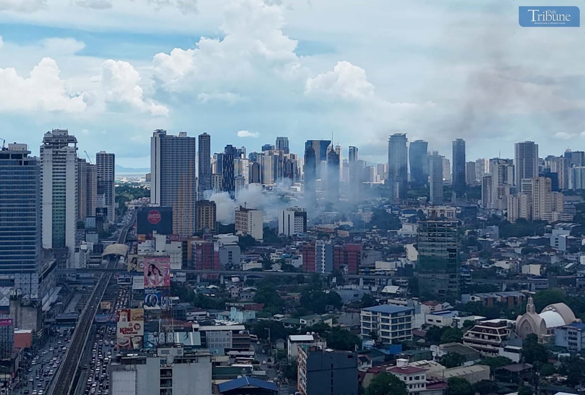 Smoke rises from a first alarm fire that broke out on 4th Avenue in Barangay Lipunan, Quezon City, on Thursday, 8 May 2025.