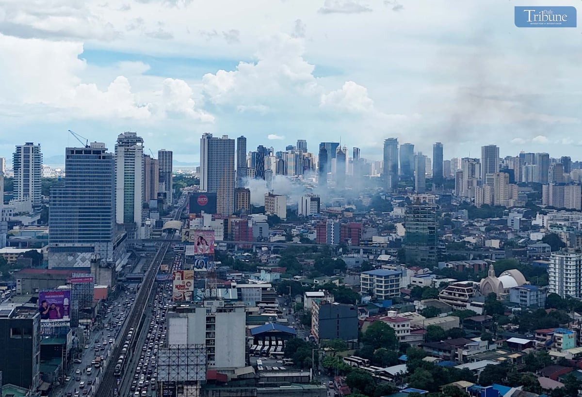 Smoke rises from a first alarm fire that broke out on 4th Avenue in Barangay Lipunan, Quezon City, on Thursday, 8 May 2025.
