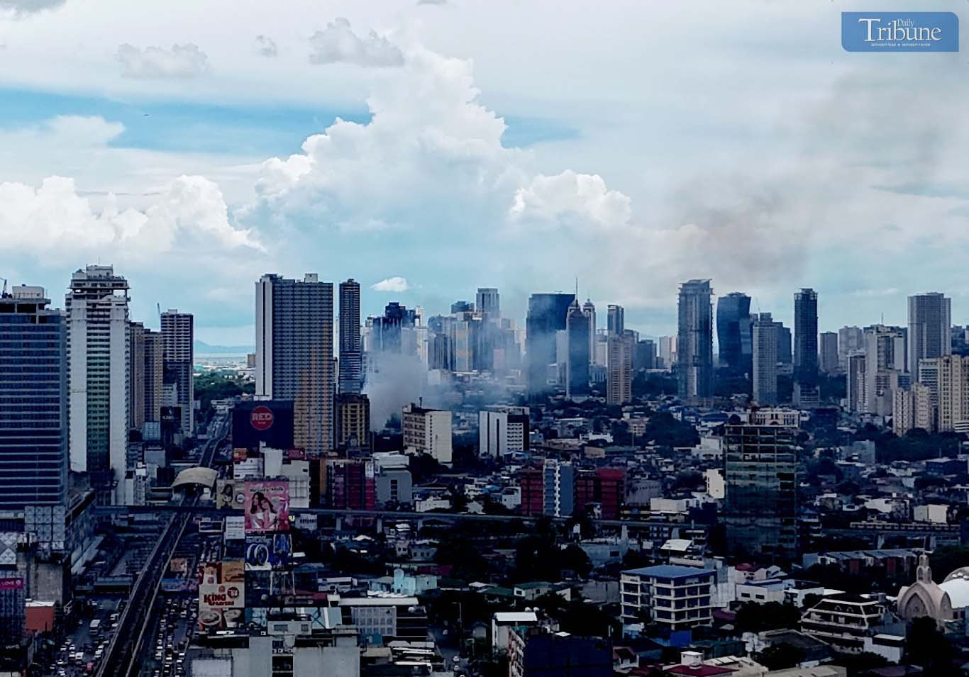 Smoke rises from a first alarm fire that broke out on 4th Avenue in Barangay Lipunan, Quezon City, on Thursday, 8 May 2025.